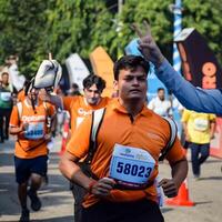 New Delhi, India - October 15 2023 - Vedanta Delhi Half Marathon race after covid in which marathon participants about to cross the finish line, Delhi Half Marathon 2023 photo