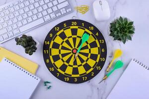 Target and goal concept with darts and arrows photo