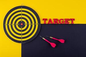 Target and goal concept with darts and arrows photo