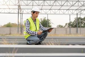 inspector or engineer is inspecting construction and quality assurance new house using a checklist. Engineers or architects or contactor work to build the house before handing it over to the homeowner photo