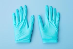 AI generated Latex Pair of medical gloves on blue background. Generate Ai photo