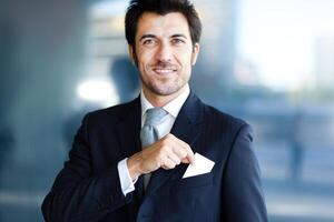 Businessman taking a greeting card out of his pocket photo