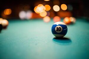 Closeup shot of a number 10 ball on a pool table photo