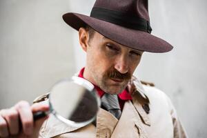 Detective using a magnify lens photo