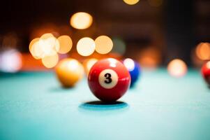 Closeup shot of a number 3 ball on a pool table photo