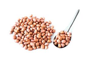 Pile of peeled off peanut seeds isolated on white background. Concept, healthy food, grains with good for health, can be cooked as ingredient in various food menu or snack. photo