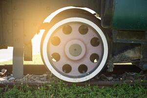 a train wheel with a lot of holes on it photo
