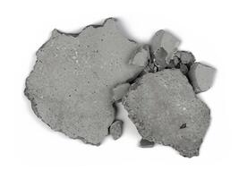 a broken concrete block on a white surface photo