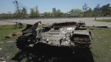 The remains of a burnt and destroyed tank of the Russian army as a result of a battle with Ukrainian troops near Kyiv. Russian aggression in Ukraine. video