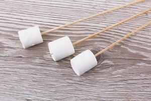 Marshmallows on wood photo