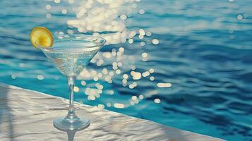 AI generated cocktail on the pool deck, its crystal-clear glass shimmering in the sunlight against a backdrop of tranquil blue waters, evoking a sense of luxury and relaxation. photo