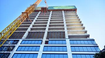 High-rise building under construction. Modern office building. photo