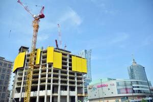 High-rise building under construction. Modern office building. photo