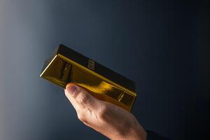 Financial wealth business investment and trading concept.gold bars or gold ingot stacking. photo