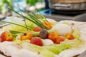 Fresh onions and tomatoes ready for cooking photo