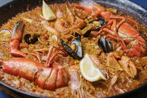 Paella seafood and lobster spanish tradicional food photo