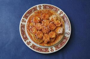 Galician wing octopus served on a plate photo