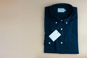 New black colour shirt and blank label. photo