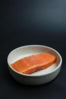 Portioned raw slices of fresh raw salmon photo