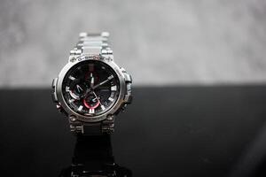 Bangkok, Thailand - February 9, 2024 Silver wristwatch of Casio G-Shock model MTG-B1000D-1ADR. The luxury fashion watch photo