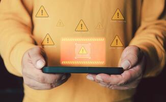 System warning caution sign on smartphone, scam virus attack on firewall for notification error and maintenance. photo