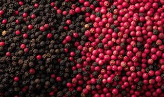 ai generado rojo, negro, blanco y rosado granos de pimienta en negro antecedentes foto