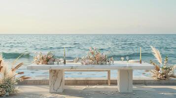 AI generated a white marble table set up for a mockup against the backdrop of a romantic beach wedding reception, featuring soft sand, gentle waves, and dreamy coastal decor. photo