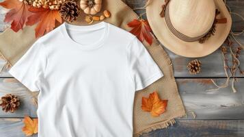 AI generated a white t-shirt mockup with a blank shirt template photo, featuring stylish fall accessories against a rustic burlap background for a trendy and seasonal aesthetic. photo