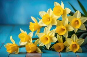 ai generado madres día, internacional De las mujeres día, S t. David día, ramo de flores de amarillo narcisos, primavera flores, azul antecedentes foto