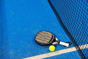 paddle sport on the paddle court, ball, rackets photo