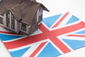 Small house on a flag - Living or migrating to United Kingdom photo