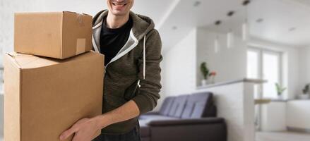 man moving to a new home with box photo