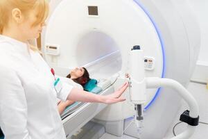 Medical CT or MRI Scan in the modern hospital laboratory. Interior of radiography department. Technologically advanced equipment in white room. Magnetic resonance diagnostics machine photo