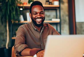 AI generated Smiling Man Sitting at Table With Laptop. Generative AI. photo