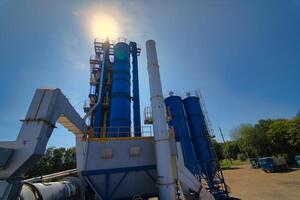 Construction site. Construction of a plant for the production of asphalt. photo