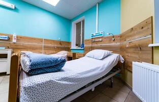 Hospital patient ward or intensive care unit. empty bed room interior for nursing care and health treatment service backdrop photo