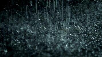Slow motion heavy rain water drops on surface street video