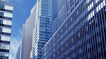 Glass skyscraper building clouds blue sky video