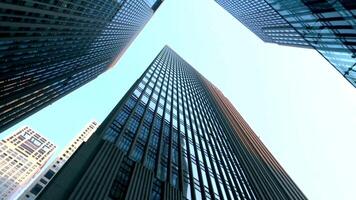 Glass skyscraper building clouds blue sky video