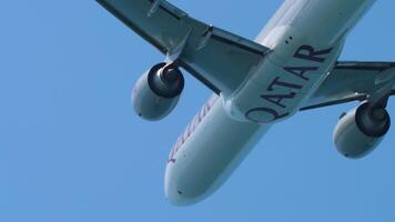 PHUKET, THAILAND - JANUARY 22, 2023. Boeing 777, A7-BAV Qatar Airways taking off at Phuket airport. Widebody aircraft overhead video