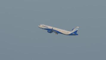 BANGKOK, THAILAND - JANUARY 20, 2023. Airbus A320 of IndiGo takes off. Airliner departure. Passenger flight in the sky, side view video