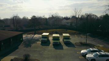 Chicago Illinois 19.03.2022 Aerial view Three ambulances waiting to be called. Clinic parking and ambulances with beacons on. Illinois Ambulance. video