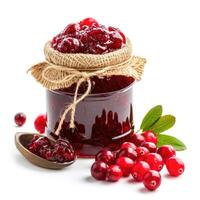 AI generated Tangy cranberry jam marmalade jelly preserves in a glass jar, accompanied by fresh cranberries, presented on a clean white backdrop, Ai Generated. photo