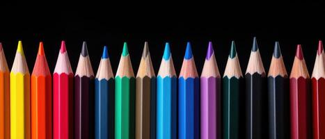 AI generated Close-up of a row of colored pencils arranged neatly on a sleek black table background, Ai Generated. photo