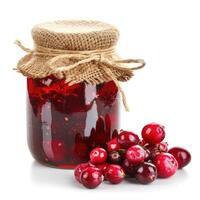 AI generated Tangy cranberry jam marmalade jelly preserves in a glass jar, accompanied by fresh cranberries, presented on a clean white backdrop, Ai Generated. photo