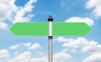 Mockup green road sign pole on blue sky background with clipping path for mockup photo