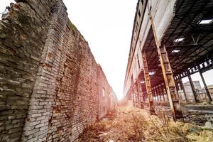 Old industrial building for demolition. Factory ruins photo