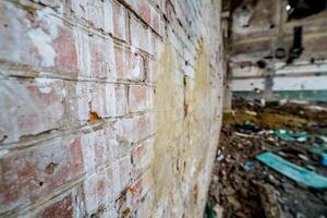 Abandoned building. Old factory ruin and broken windows photo