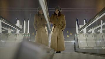 Stylish Elegant Woman Standing on Escalator Commuting in the City video