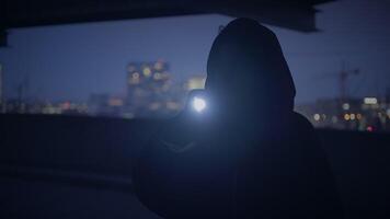 Fearful Young Woman Holding Flashlight Outside in Dark Night video